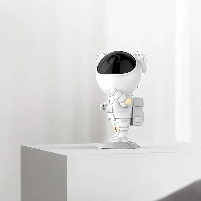 Astronaut star projector with snow effects, remote control, and timer for atmospheric bedroom lighting | Sansoti