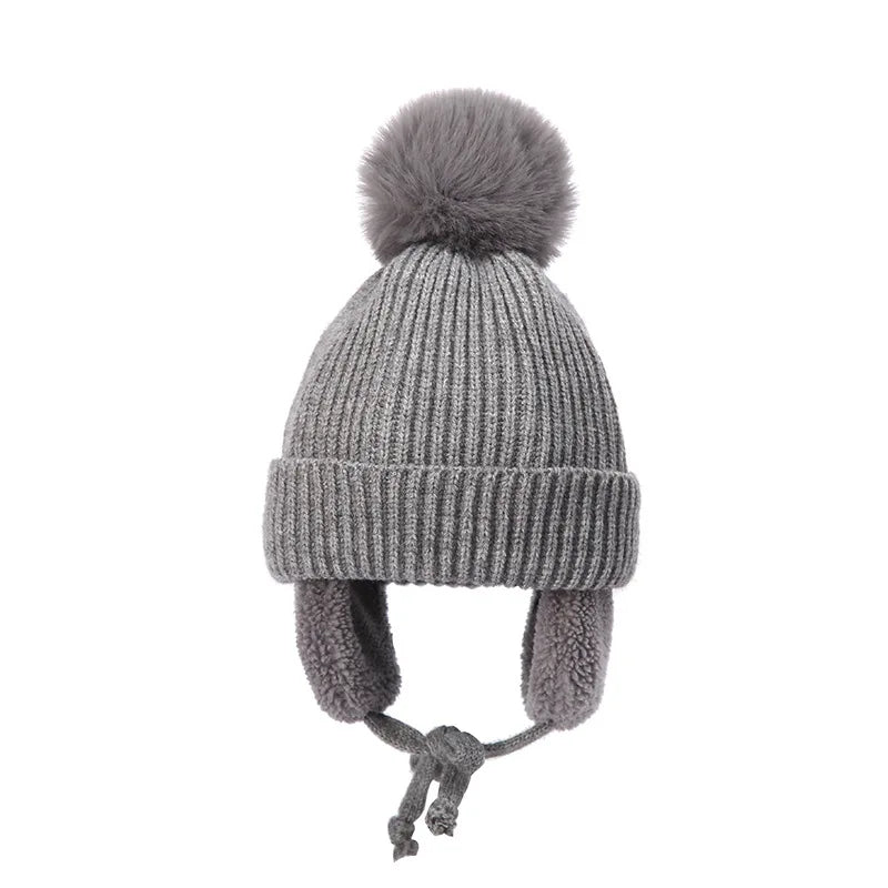 Bonnet tricoté pour enfants avec protège-oreilles et pompon, doublure douce en polaire, bonnet d'hiver chaud pour garçons et filles | Sansoti