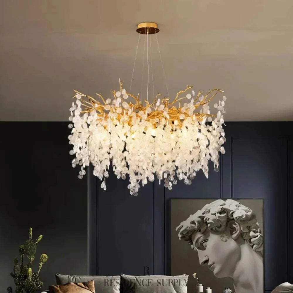 Luxe Kristallen Kroonluchter Met Gouden Takkenstructuur En Sprankelende Lichtval | Sansoti