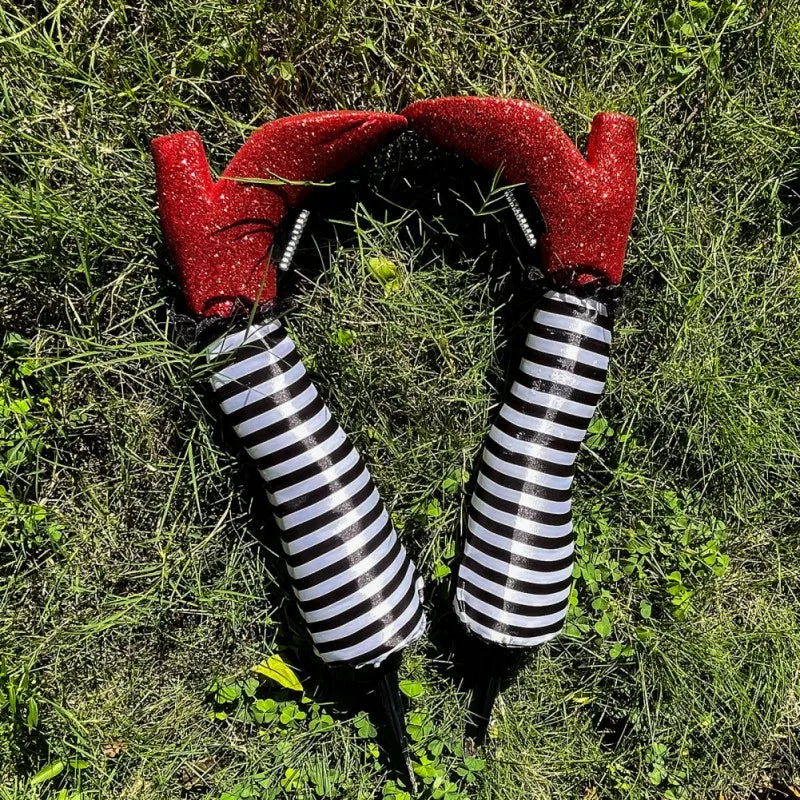 Halloween garden decoration: witch legs with striped stockings and boots for lawn, garden, and party decor | Sansoti