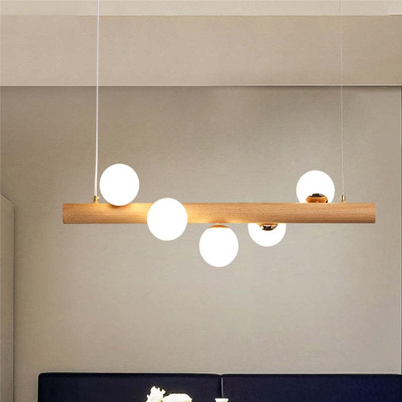 Hängeleuchte Glaskugel mit Deckenbefestigung aus Holz in warmem Walnusston - elegante Ambientebeleuchtung für das Wohnzimmer | Sansoti