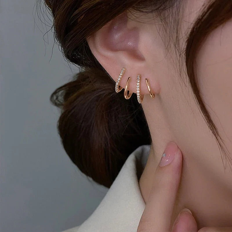 Boucles d’oreilles élégantes avec design à quatre griffes or argent | Sansoti
