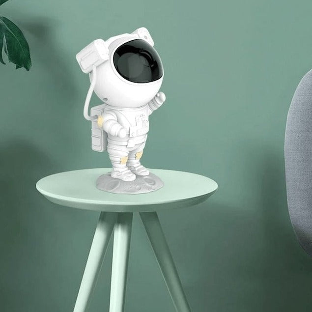 Astronaut star projector with snow effects, remote control, and timer for atmospheric bedroom lighting | Sansoti