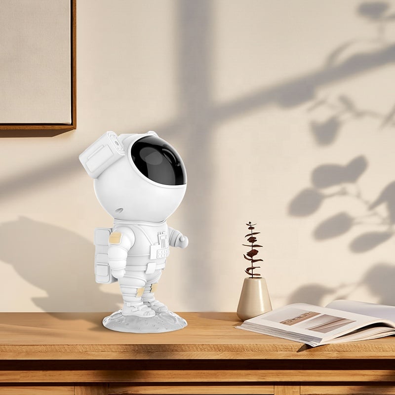 Astronaut star projector with snow effects, remote control, and timer for atmospheric bedroom lighting | Sansoti