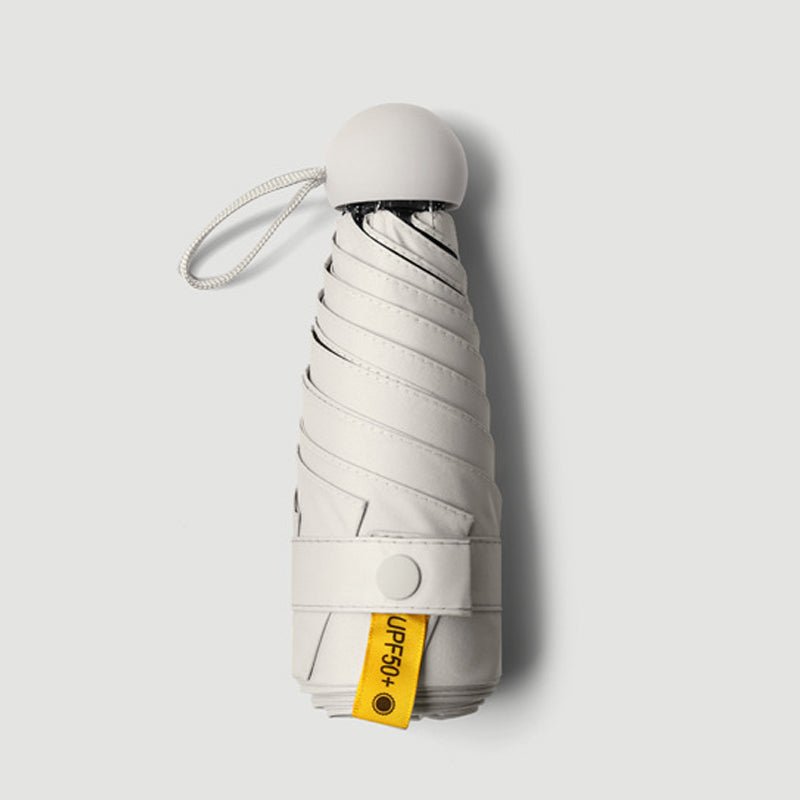 Kompakter faltbarer Regenschirm Capsule UPF50+ UV-Schutz im Taschenformat windbeständiger Mini-Reiseschirm | Sansoti